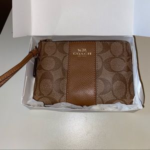 COACH small tan colored wristlet